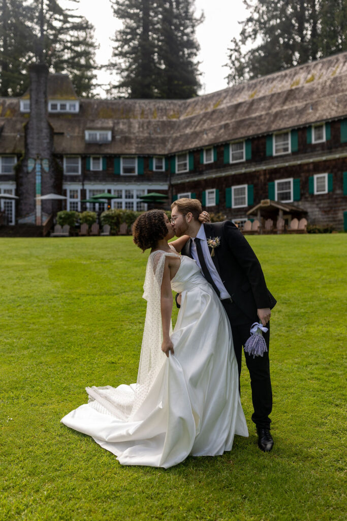 couple kissing at lake quinault lodge 