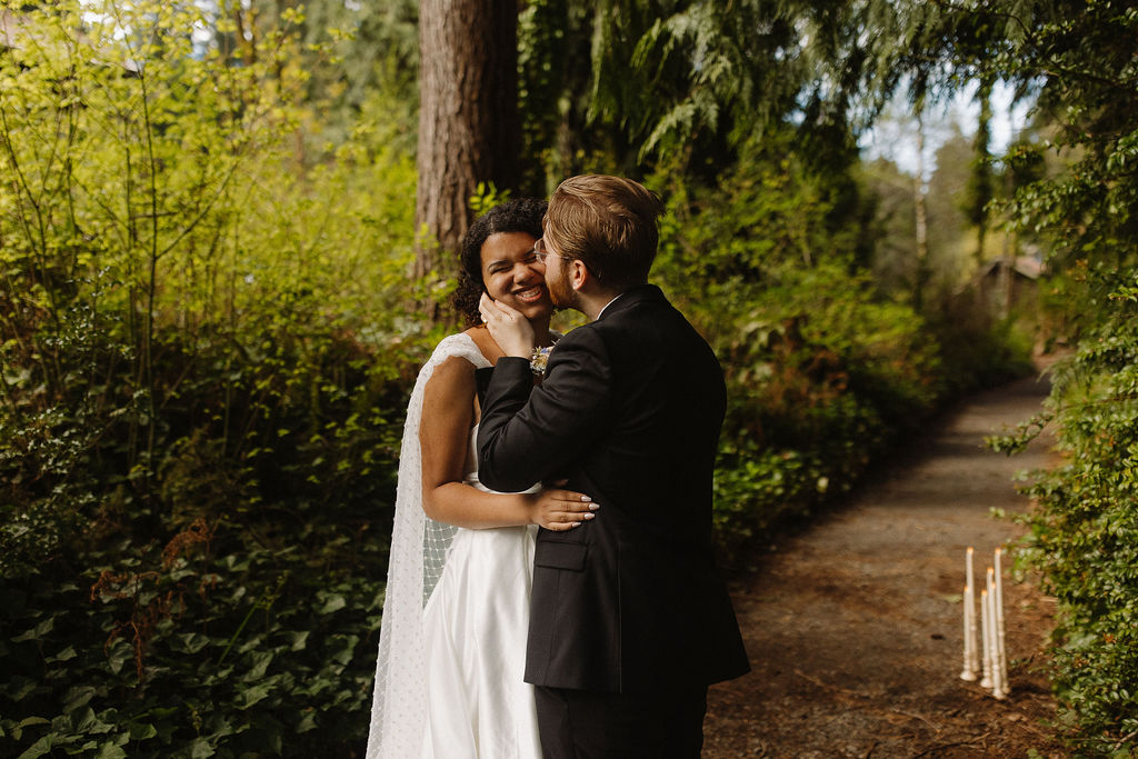 couple kissing after their ceremony at lake quinault lodge