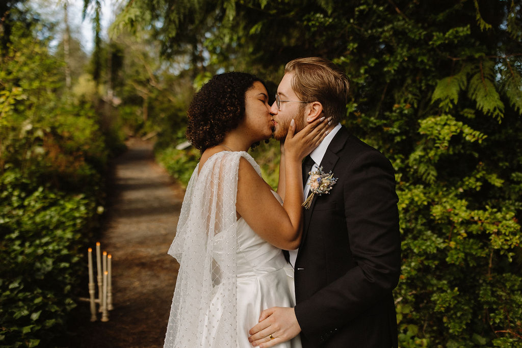 couple kissing in the forest at lake quinault lodge