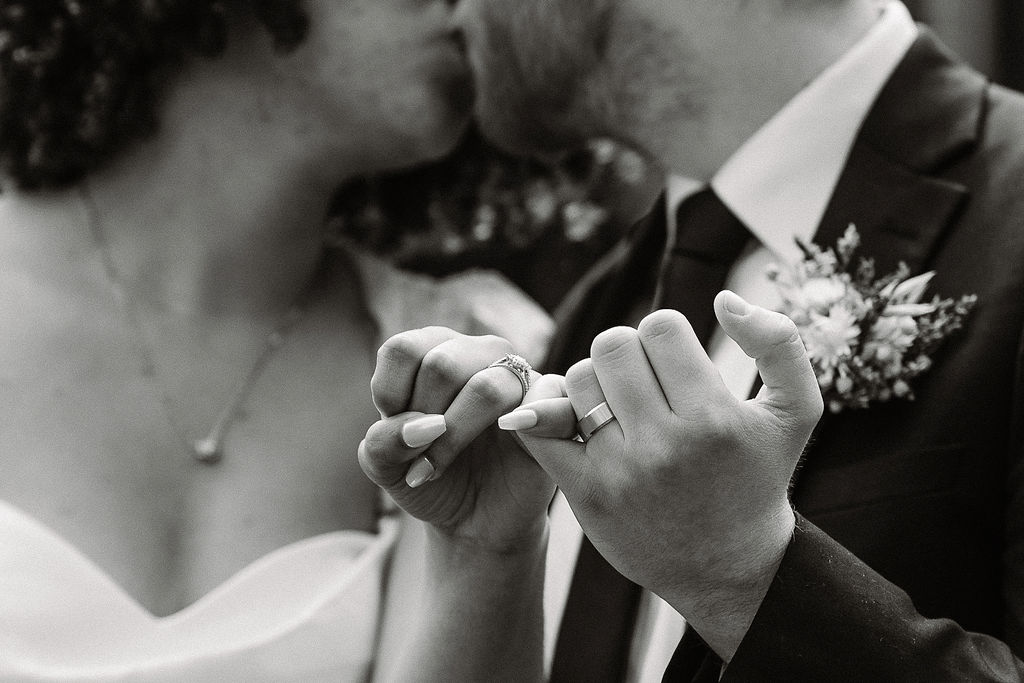 couple showing their rings to the camera