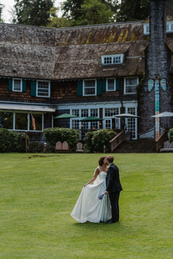 couple kissing at their wedding venue