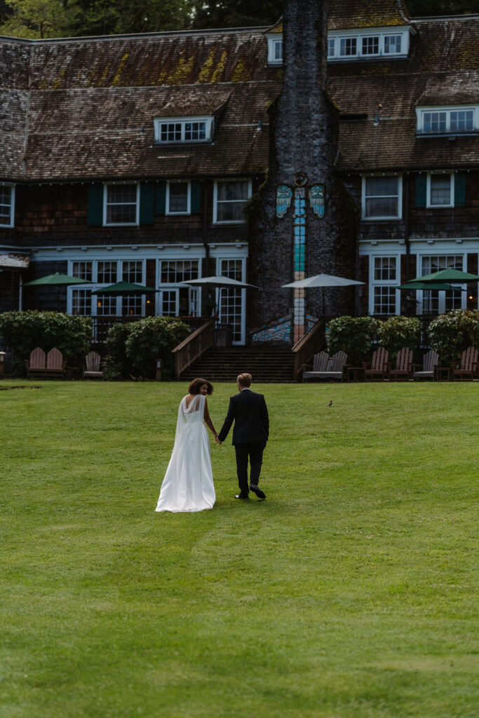 couple walking to lake quinault lodge 