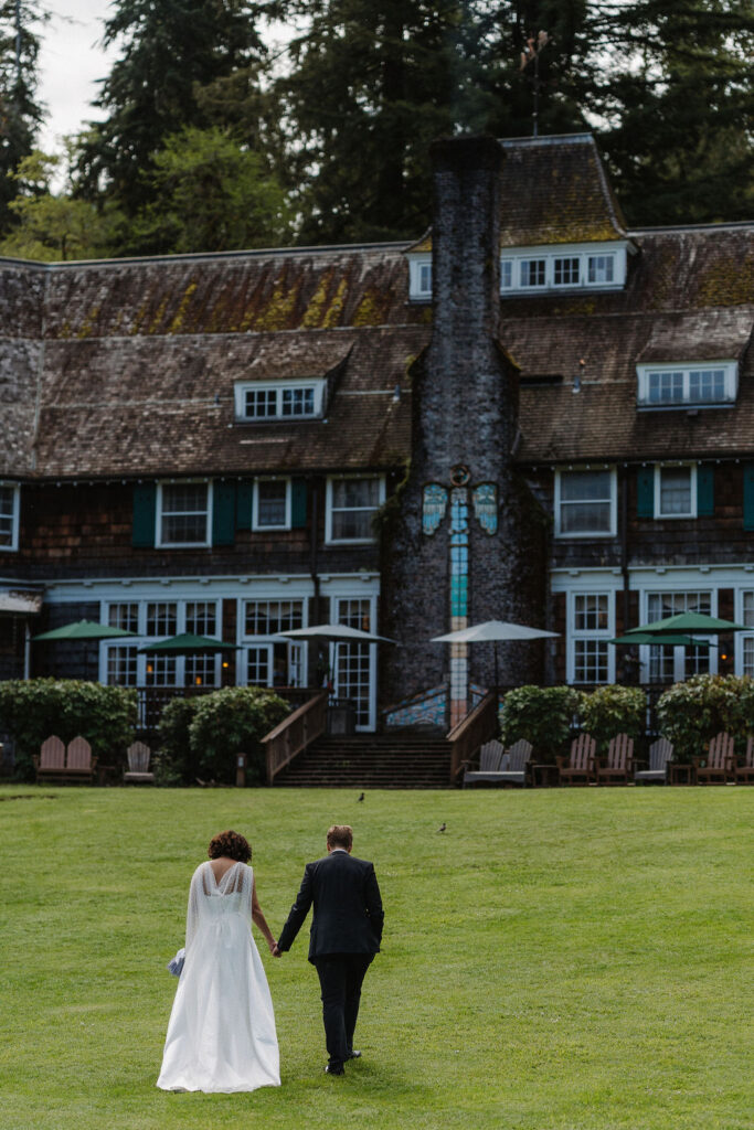 beautiful shot of the couple walking to lake quinault lodge