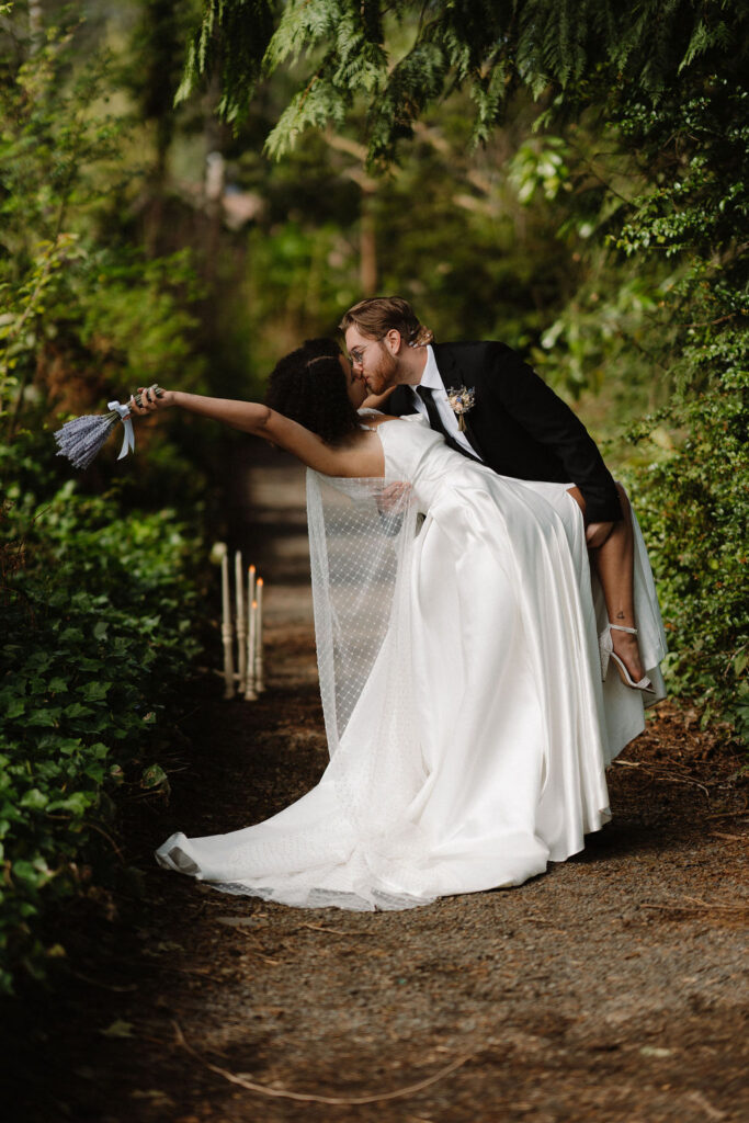 couple kissing after their ceremony at lake quinault lodge