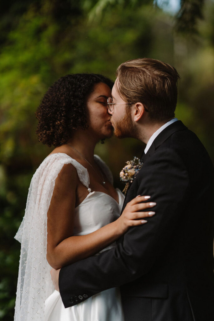 stunning couple kissing after their wedding ceremony 