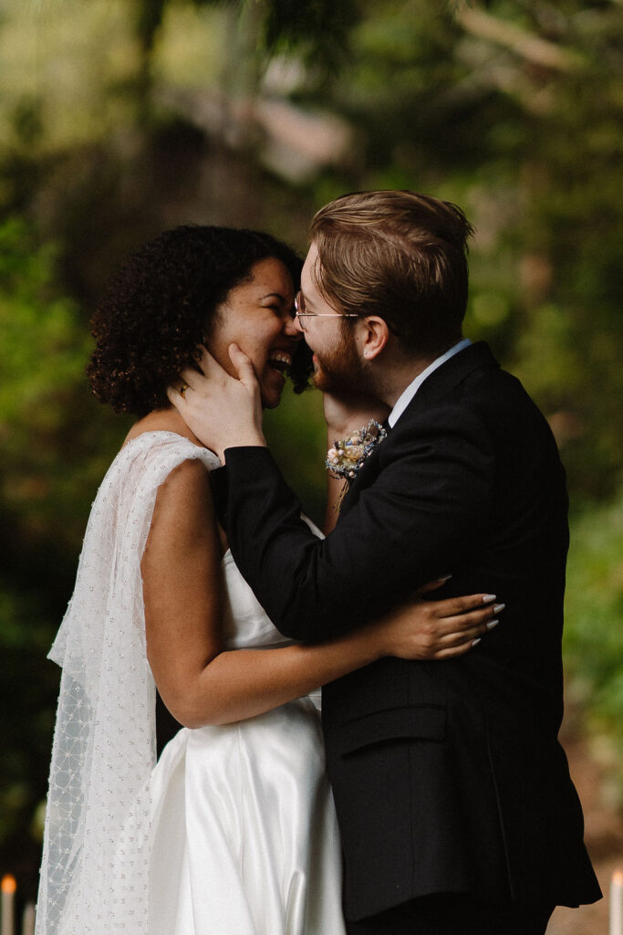 couple kissing after their wedding ceremony 