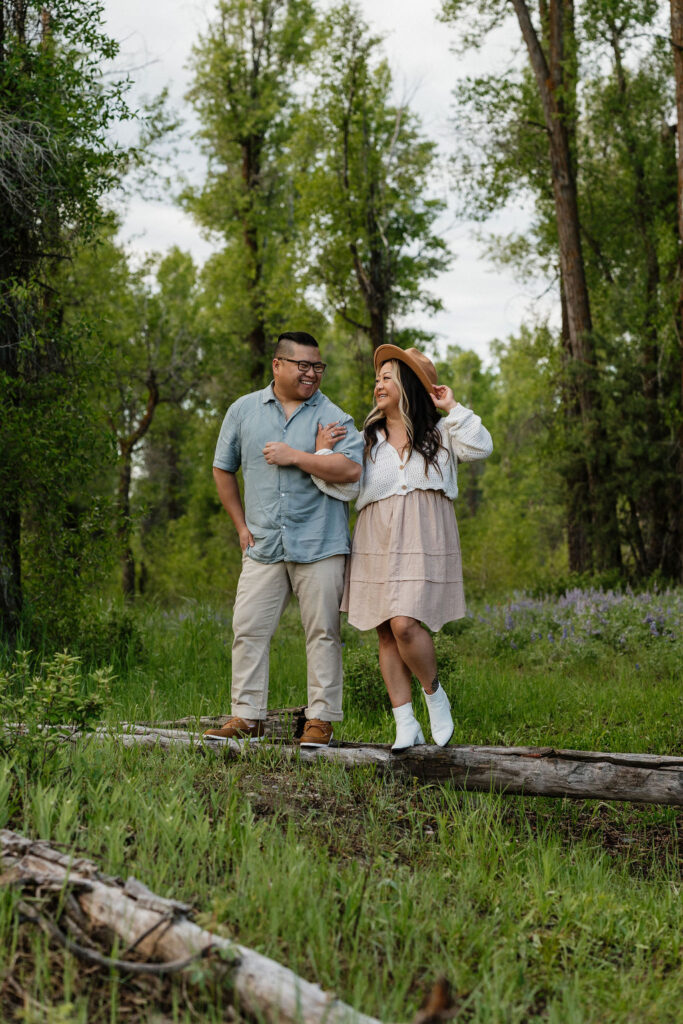 couple being playful during their romantic boho engagement