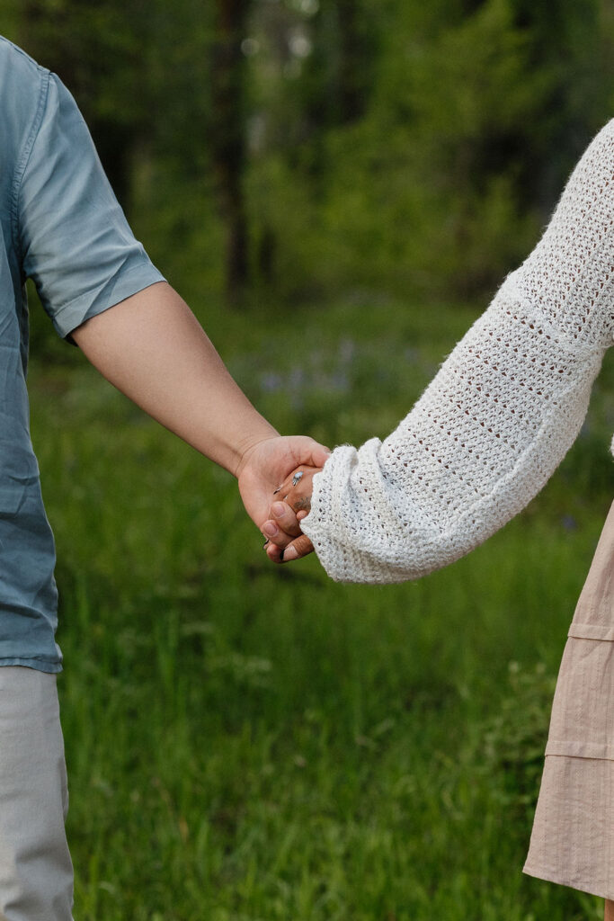 newly engaged couple's hand 