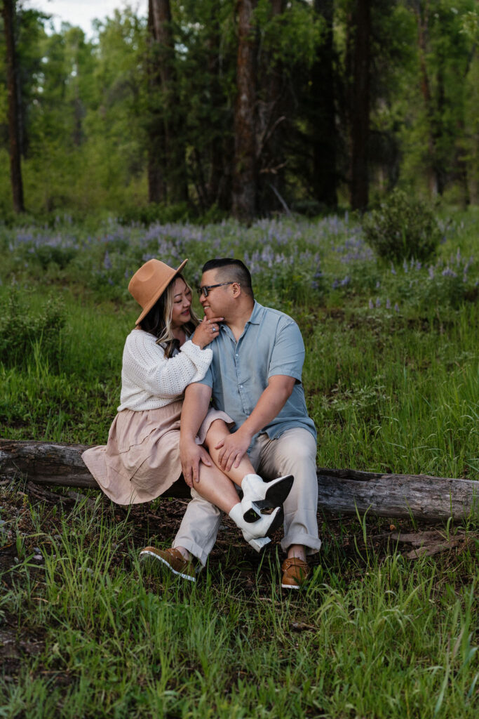 couple sitting on a tree at GTNP 