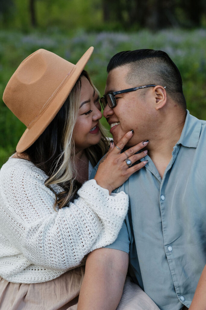 couple kissing at their romantic boho engagement