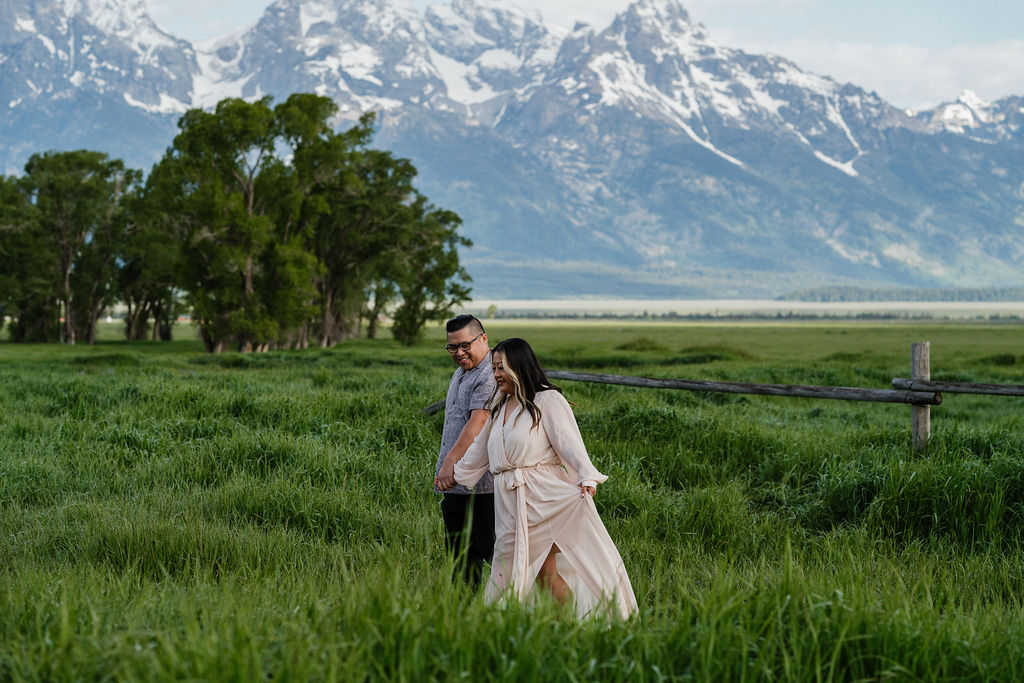 couple walking during their romantic boho engagement session