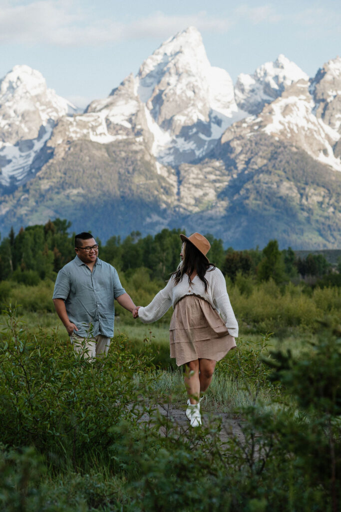 couple walking around during their romantic boho engagement 