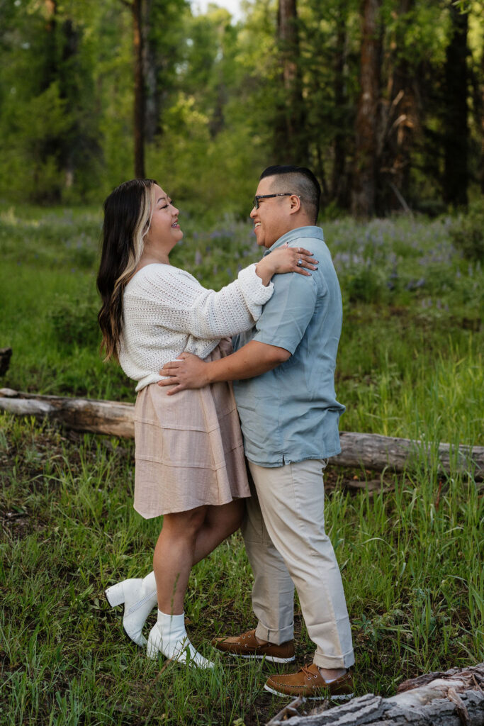 couple hugging during their romantic boho engagement 