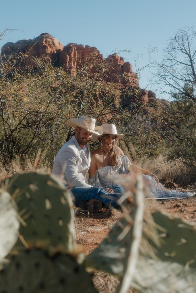 couple sitting at their elopement location 