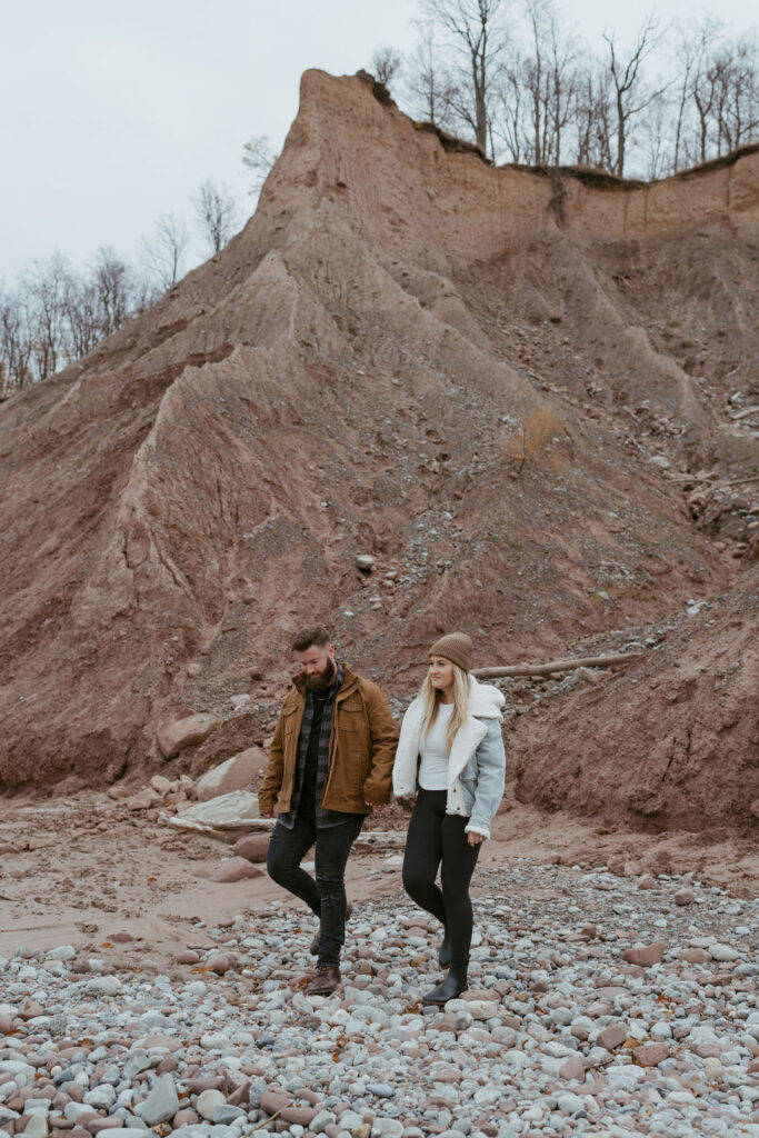 couple walking around their adventurous engagement 