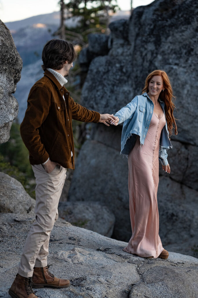 couple laughing with each other during their sunrise engagement session