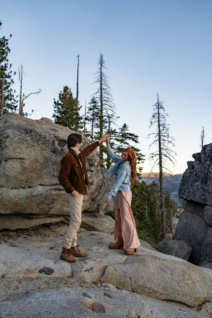 couple dancing during their sunrise engagement session 