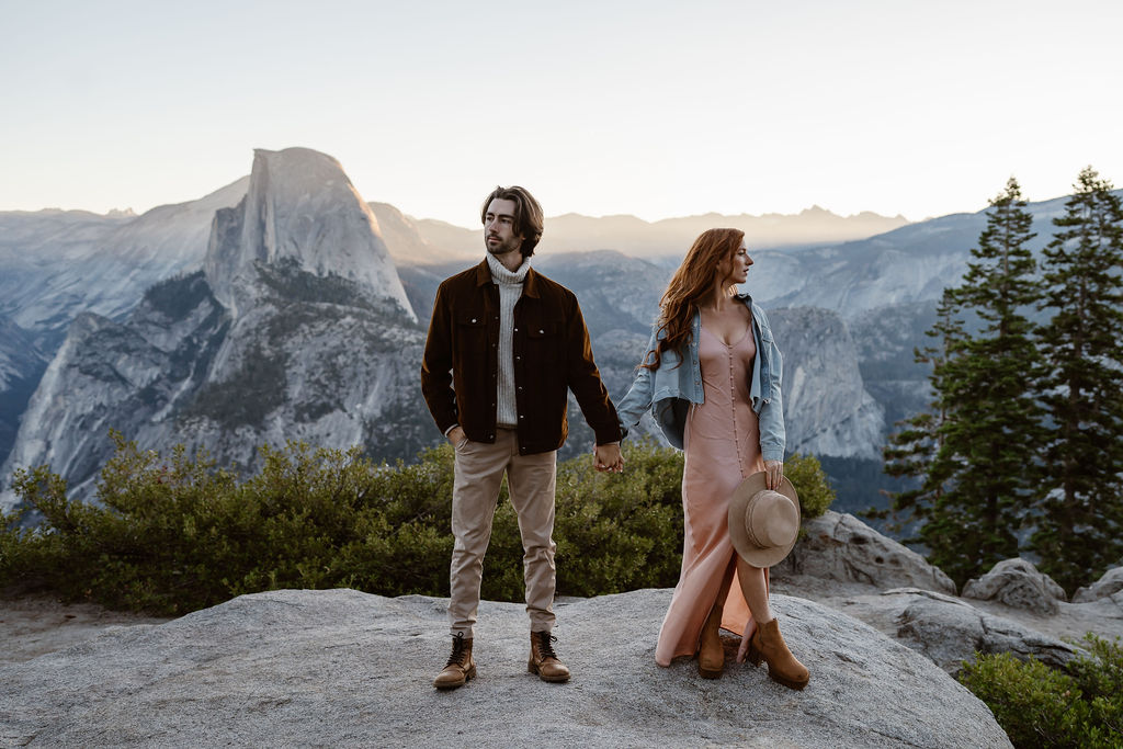 gorgeous couple at their sunrise engagement session with yosemite national park in the background