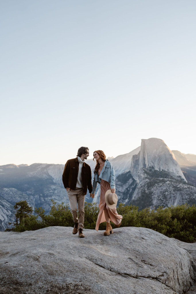 cute couple looking at each other during their sunrise engagement session