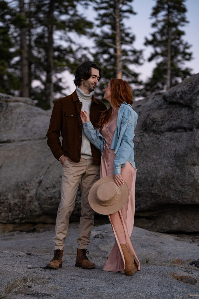 cute couple kissing at their engagement photoshoot 