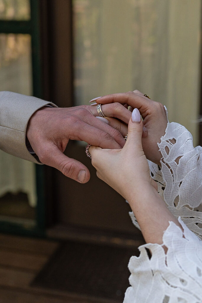 bride and groom exchanging rings 