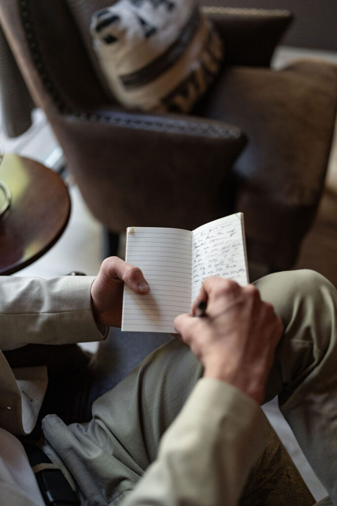 groom writing his vows 