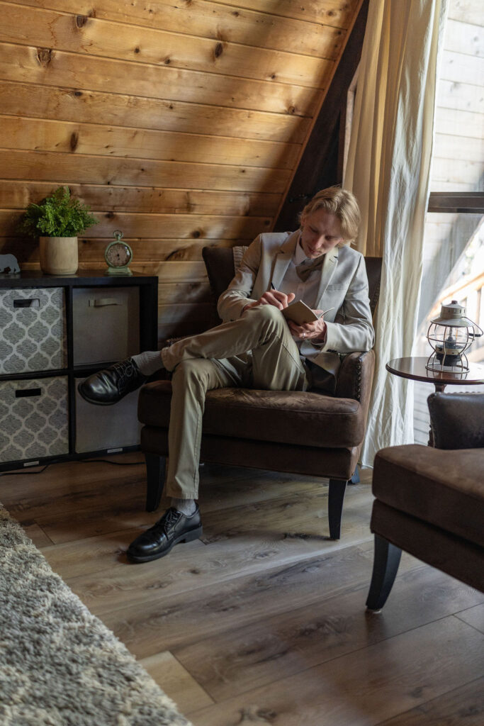 groom before his cozy cabin elopement ceremony