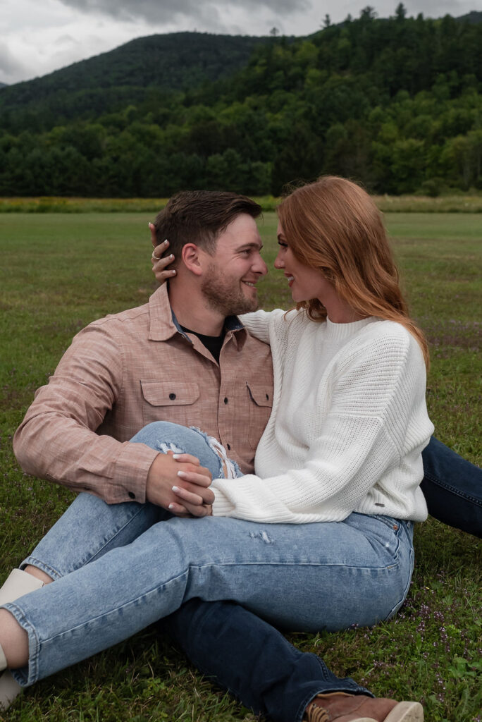 happy couple smiling at each other during their engagement photos