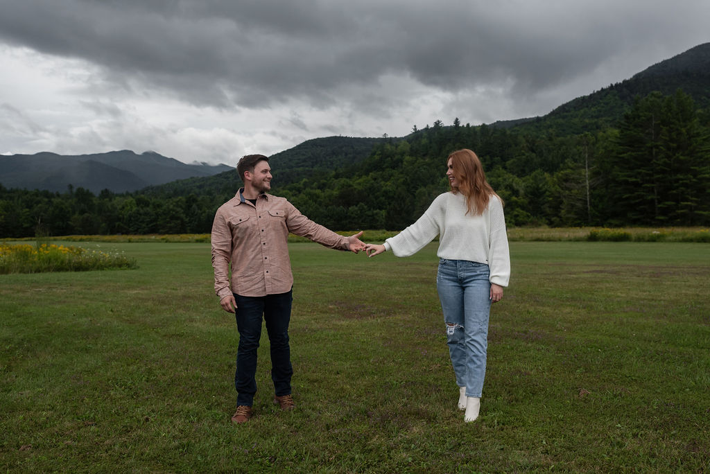 couple holding hands looking at each other