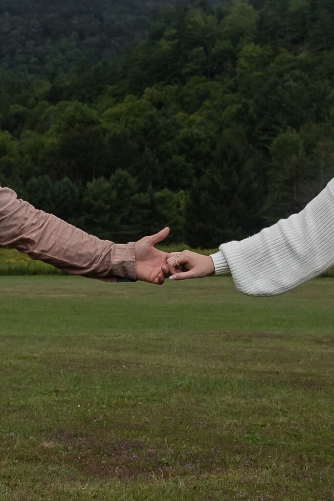 closeup shot of the couple holding hands 