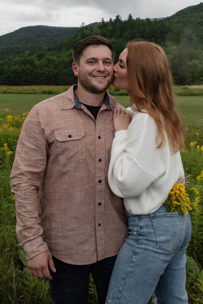 fiance kissing her fiance on the cheek 