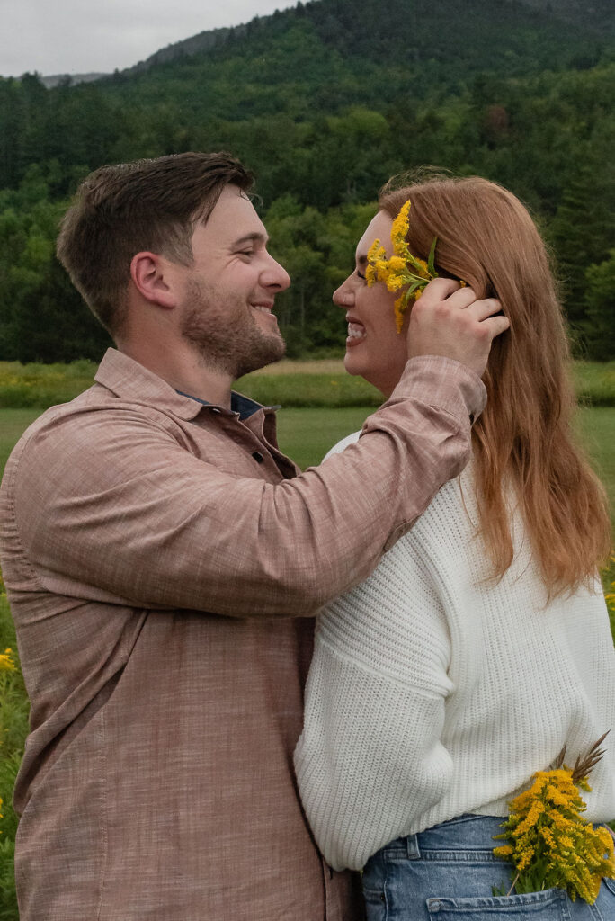 happy newly engaged couple at lake placid 