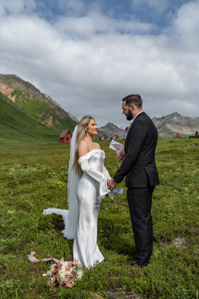 how to elope in hatcher pass - bride and groom holding hands 