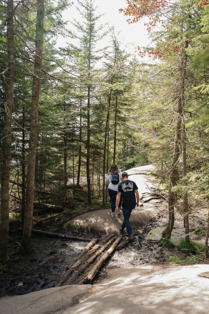 bride and groom walking around bald mountain 