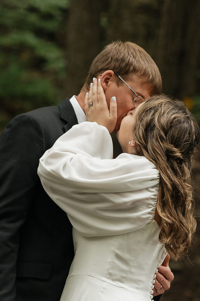 portrait of the bride and groom kissing