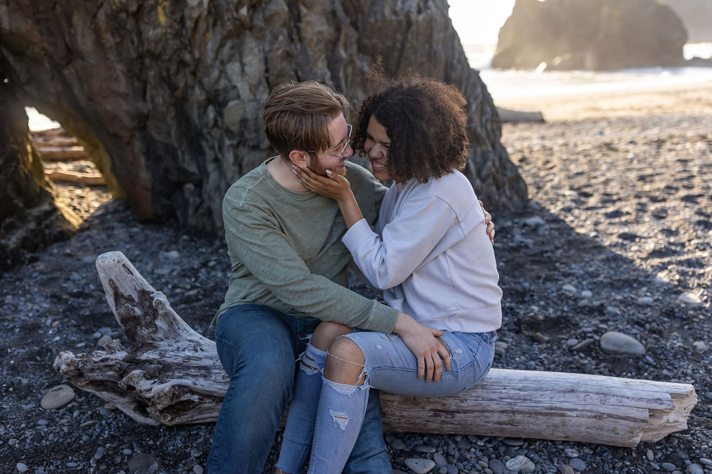 cute couple smiling at each other during their photoshoot