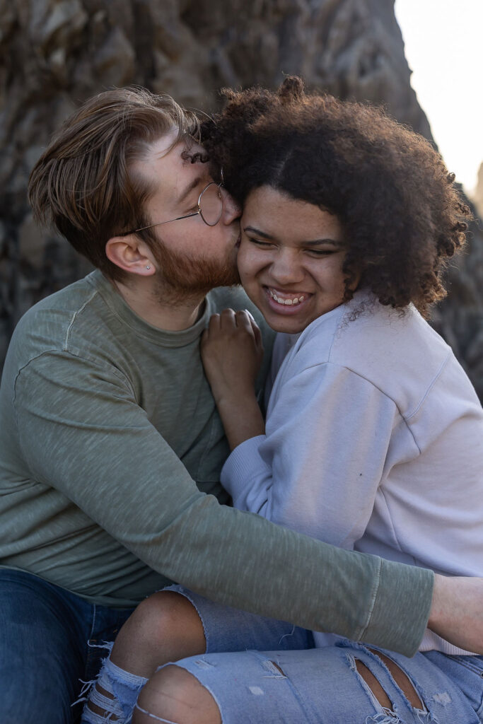 fiance kissing his fiance on the cheek 