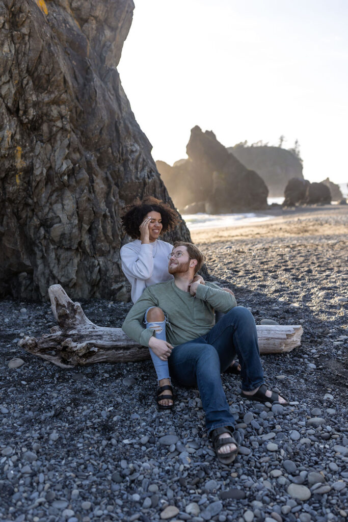 couple hugging at the beach - engagement photo location