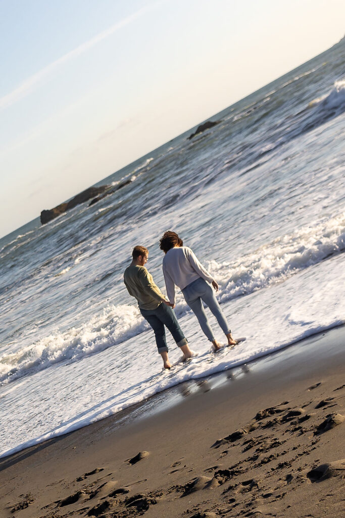 cute couple walking around ruby beach