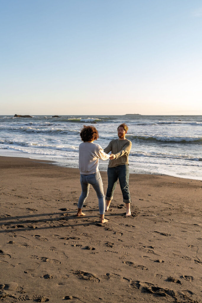 couple playing at ruby beach 