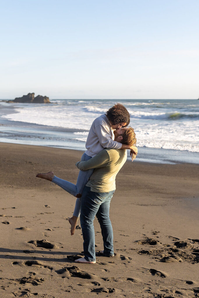 newly engaged couple kissing at their stunning engagement photo location