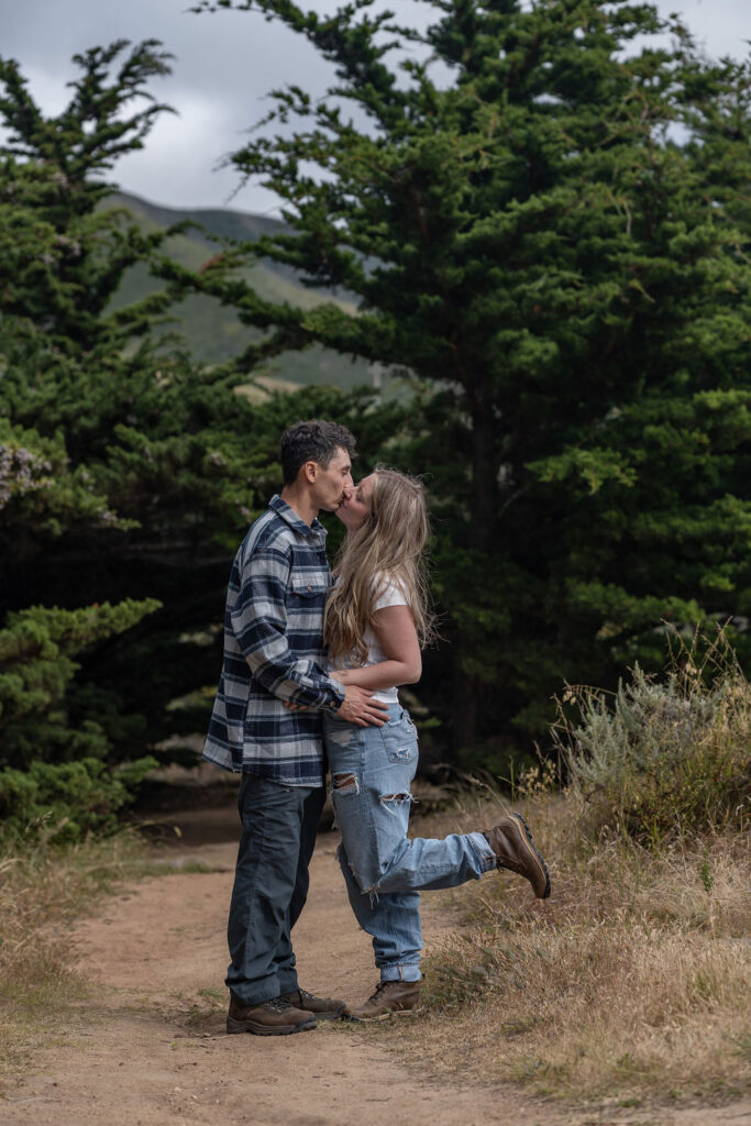 newly engaged couple kissing during their photoshoot