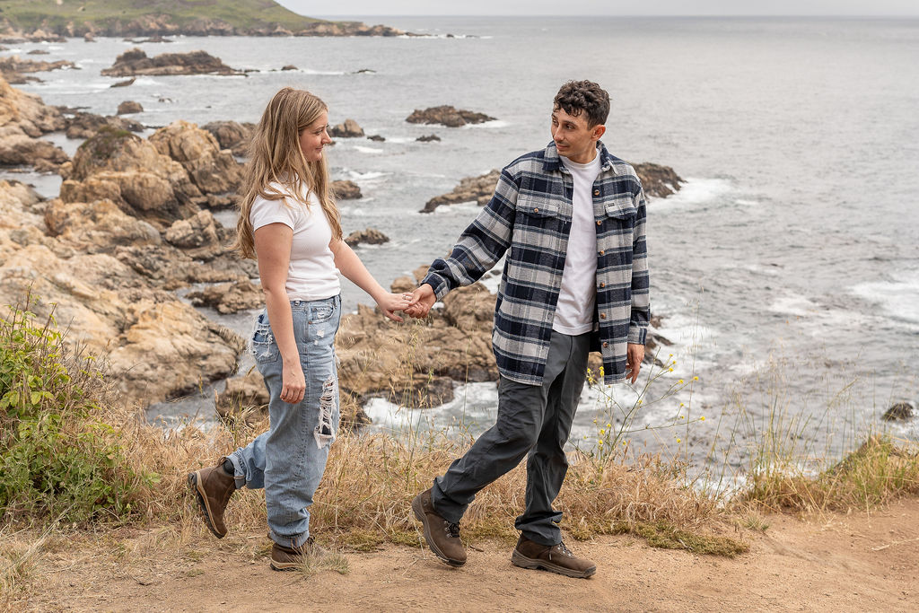 newly engaged couple walking around hwy 1