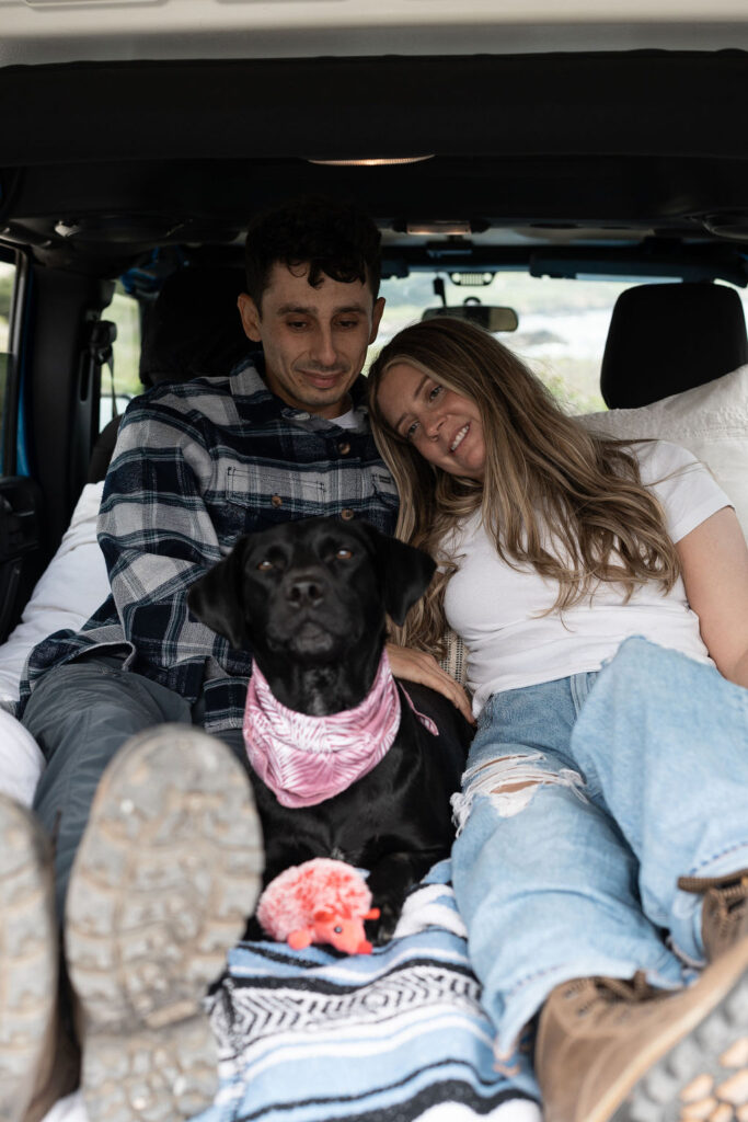 cute portrait of the newly engaged couple and their dog 