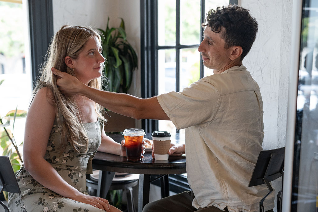 cute couple at a coffee shop during their engagement session