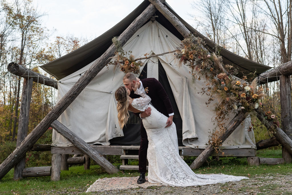 bride and groom kissing after their wedding ceremony