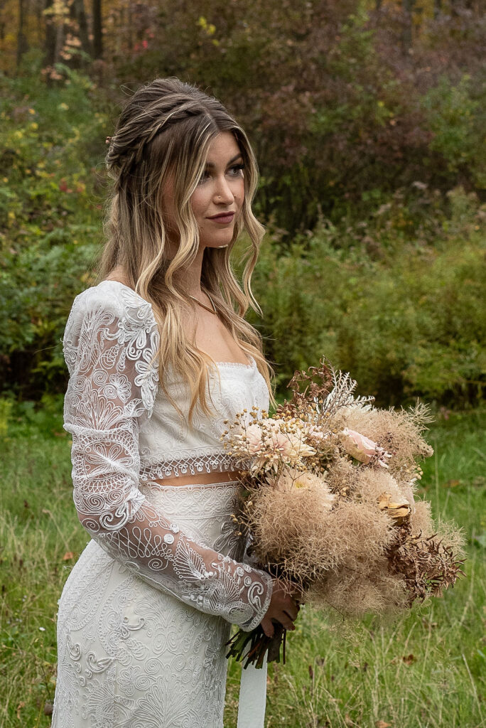 bride with her wedding bouquet before the wedding ceremony