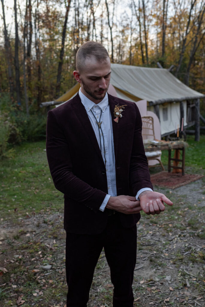 groom getting ready for his elopement ceremony