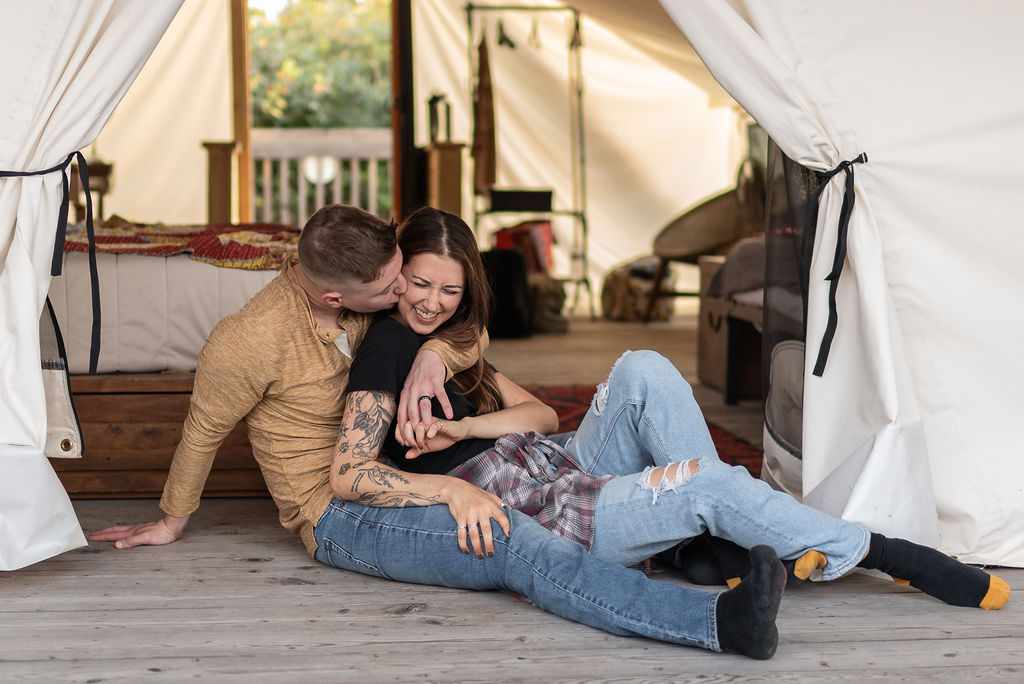 couple hugging and laughing at their adventure photoshoot