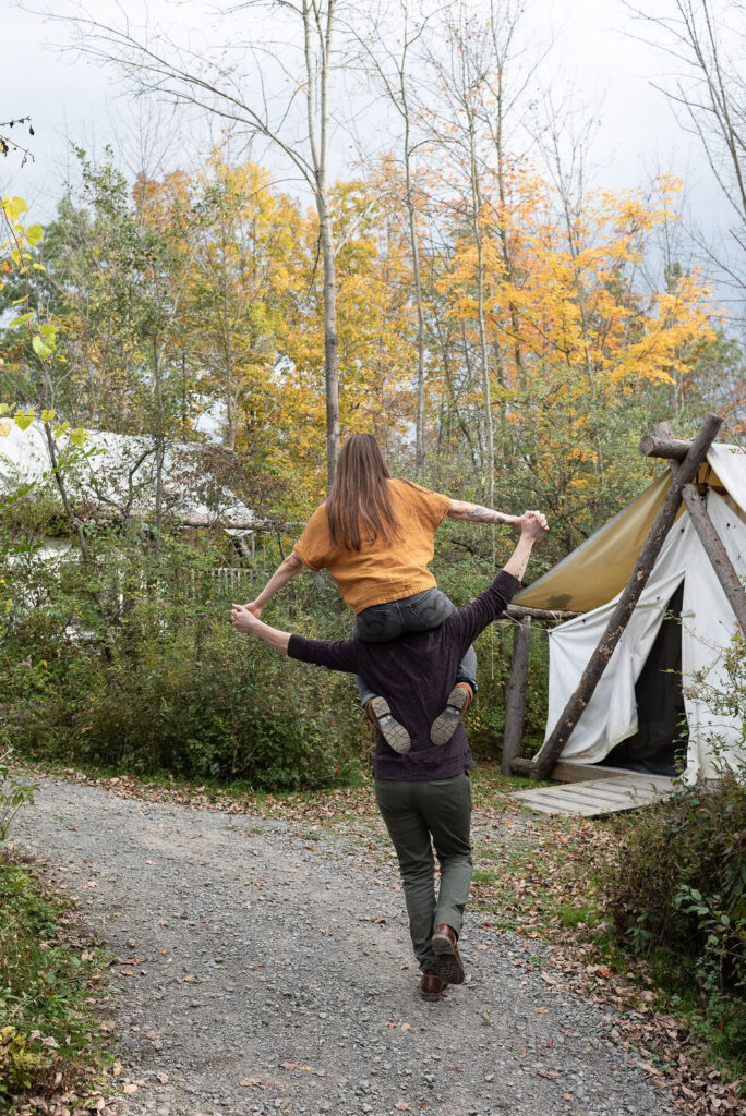 couple walking around firelight camps